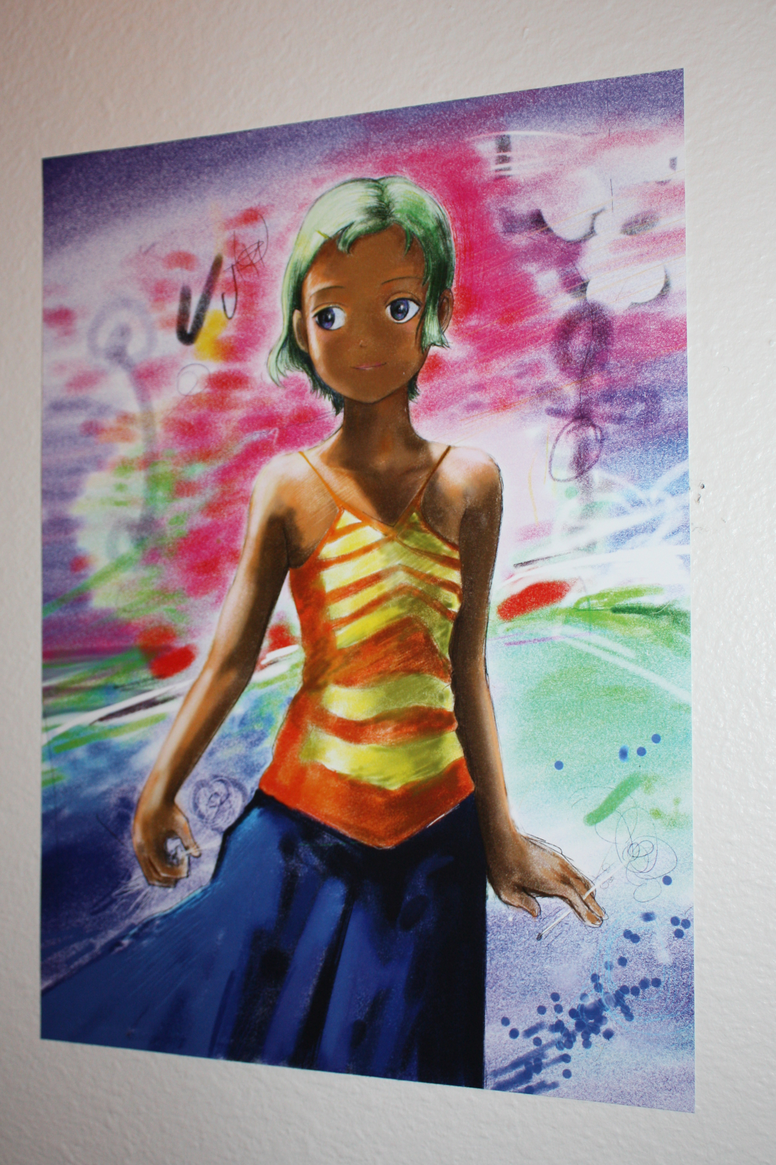 Detail of an anime girl with green hair and a dress hung on a white wall